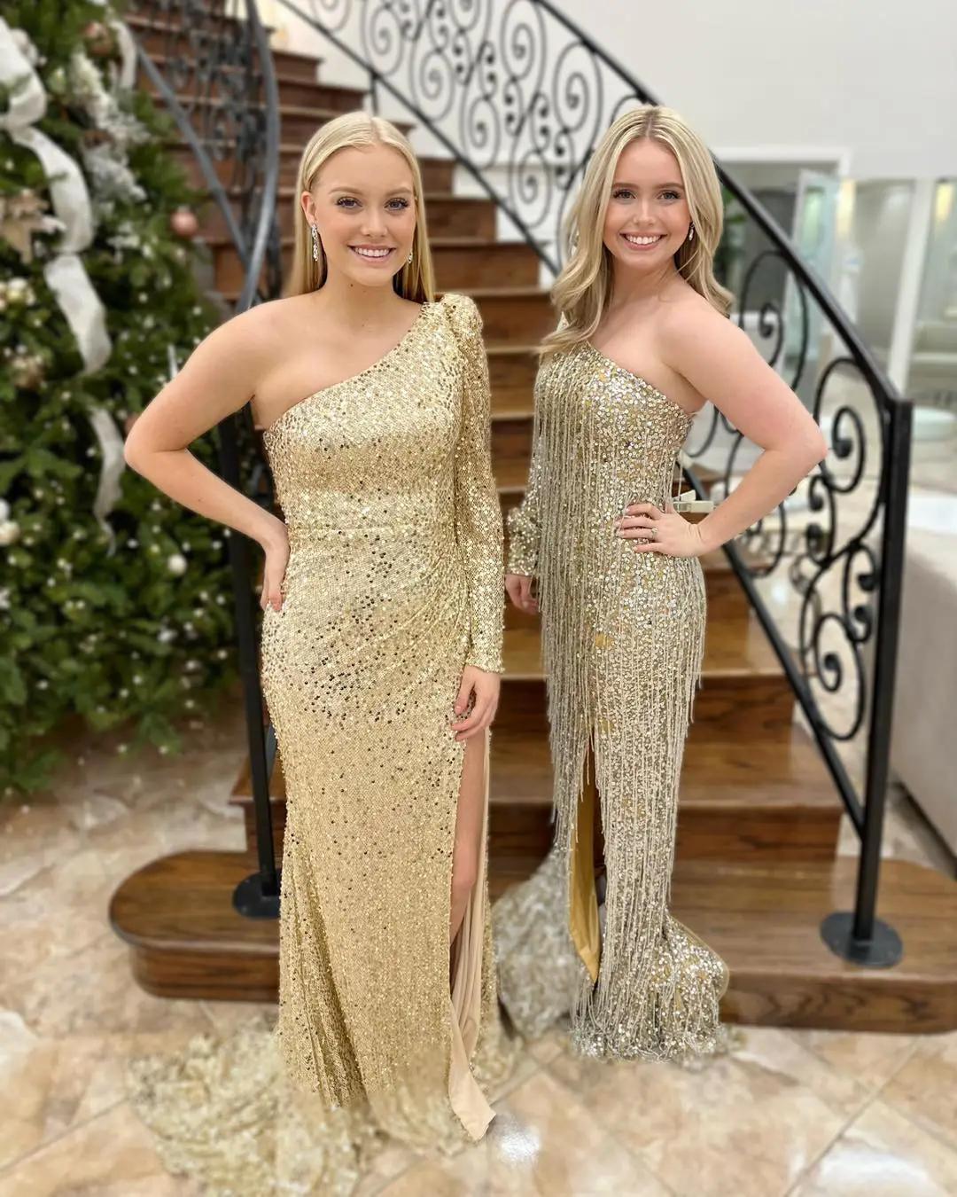 Two girls wearing prom dresses