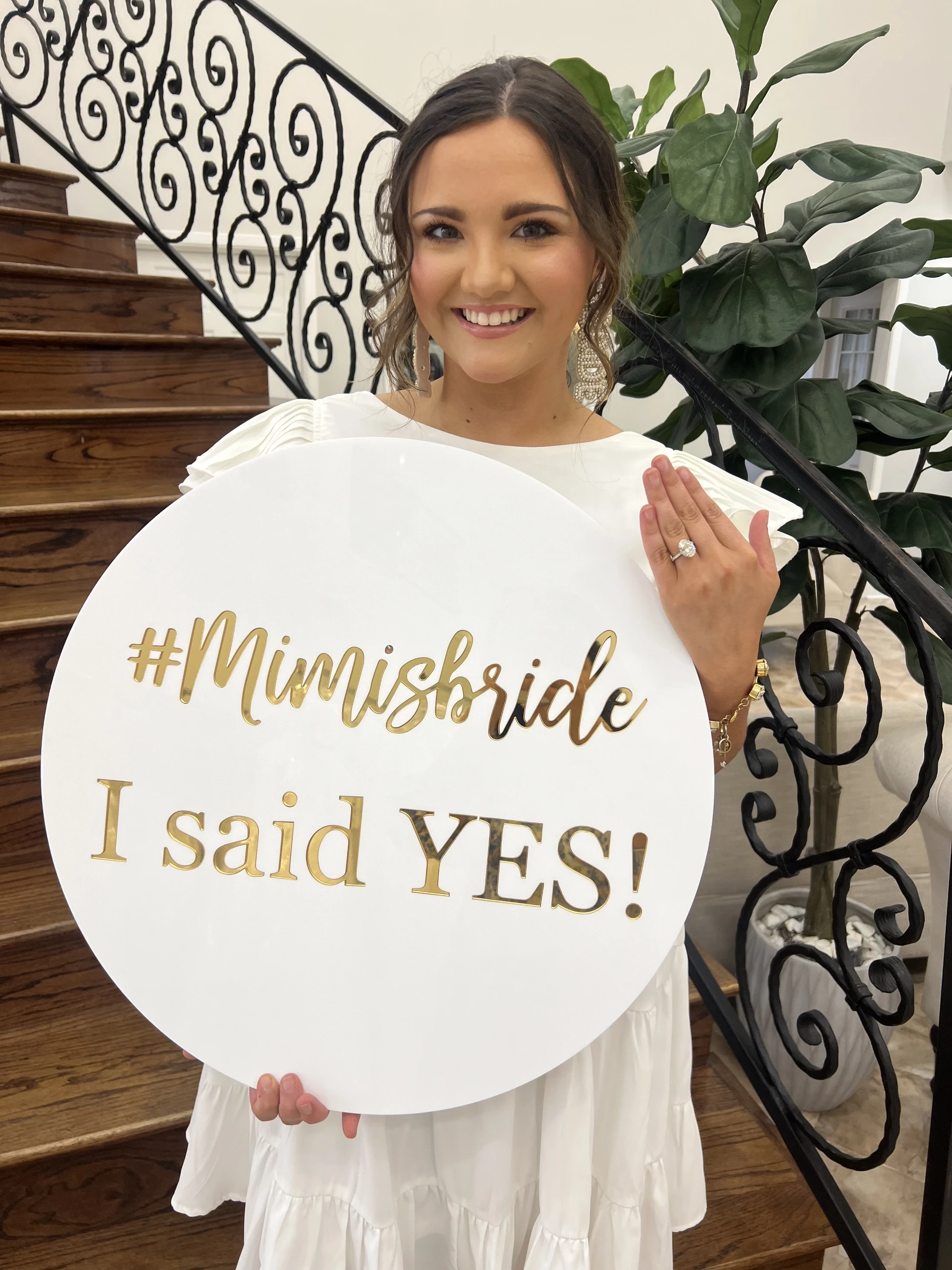 Bride holding 'say yes' sign at Mimi's Bridal